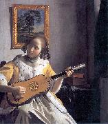 Youg woman playing a guitar